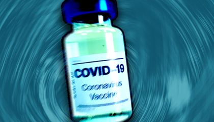 Image of a covid vaccine bottle against a blue background